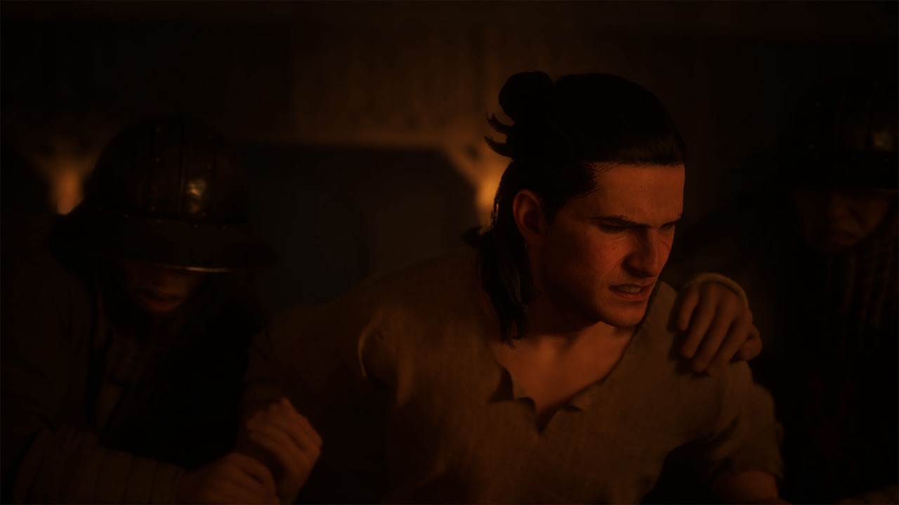 Coen held between two armed guards.